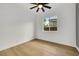 Clean bedroom with wood-look floors, ceiling fan, and an exterior view at 2921 Guillemot Ave, North Las Vegas, NV 89084