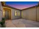 Exterior view of a beautiful courtyard with stucco walls, decorative pavers, and desert landscaping at 2921 Guillemot Ave, North Las Vegas, NV 89084
