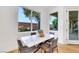 Bright dining area featuring a marble table and view of the backyard through a large window at 2921 Guillemot Ave, North Las Vegas, NV 89084