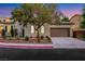 Beautiful home with desert landscaping, a wide driveway, and a well-maintained lawn at 2921 Guillemot Ave, North Las Vegas, NV 89084