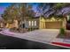 Attractive single-Gathering home with a large driveway, desert landscaping, and warm exterior lighting at 2921 Guillemot Ave, North Las Vegas, NV 89084