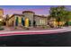 Charming single-story home with a well-manicured front yard and unique architectural details at 2921 Guillemot Ave, North Las Vegas, NV 89084