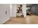 Spacious foyer with light wood floors, white walls, console table, and view to dining room at 2921 Guillemot Ave, North Las Vegas, NV 89084