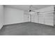 Clean, spacious two car garage with epoxy floors and white walls at 2921 Guillemot Ave, North Las Vegas, NV 89084