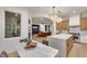 Eat-in kitchen features a spacious island with seating and overlooks the living spaces at 2921 Guillemot Ave, North Las Vegas, NV 89084