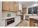 The kitchen boasts built-in stainless steel appliances, wooden cabinets, and ample counter space at 2921 Guillemot Ave, North Las Vegas, NV 89084