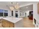 Kitchen with spacious island and stainless appliances flows into the living spaces at 2921 Guillemot Ave, North Las Vegas, NV 89084
