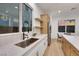 Kitchen sink with stainless appliances, open shelving, and eat-in dining at 2921 Guillemot Ave, North Las Vegas, NV 89084
