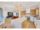 Open concept kitchen with a large island flows into the living room and backyard at 2921 Guillemot Ave, North Las Vegas, NV 89084