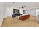 Bright and airy living room featuring a fireplace, seating, and seamless flow to adjacent rooms at 2921 Guillemot Ave, North Las Vegas, NV 89084