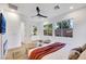 Bright bedroom with a ceiling fan, stylish décor, many windows and a view of the backyard at 2921 Guillemot Ave, North Las Vegas, NV 89084