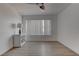 Bright bedroom with wood-look floors, white walls, and a lamp on the cabinet at 3103 Key Largo Dr # 103, Las Vegas, NV 89120