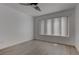 Bright bedroom with light-wood-look floors, ceiling fan, and large window at 3103 Key Largo Dr # 103, Las Vegas, NV 89120