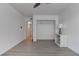 Open bedroom with a ceiling fan, closet, and wood-look floors at 3103 Key Largo Dr # 103, Las Vegas, NV 89120