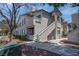 Inviting condo with desert landscaping, stairs to the unit, and neutral color palette at 3103 Key Largo Dr # 103, Las Vegas, NV 89120