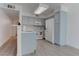 Charming kitchen featuring modern appliances, light blue cabinetry, and stylish chevron backsplash at 3103 Key Largo Dr # 103, Las Vegas, NV 89120