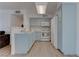 Beautiful kitchen featuring modern appliances, light blue cabinets, and wood-look flooring at 3103 Key Largo Dr # 103, Las Vegas, NV 89120