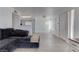 Inviting living room with new gray laminate flooring and a view of the kitchen at 3103 Key Largo Dr # 103, Las Vegas, NV 89120