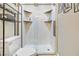 A modern bathroom featuring a glass-enclosed shower with built-in shelving and stylish tile work at 320 W Van Buren Ave, Las Vegas, NV 89106