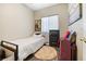 Modest bedroom with a single bed, neutral walls, and minimalist decor provides a calm and inviting space at 320 W Van Buren Ave, Las Vegas, NV 89106