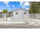 Picture of the house, showcasing its fenced perimeter, well-maintained yard, and inviting front entrance at 320 W Van Buren Ave, Las Vegas, NV 89106