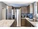 Modern kitchen with stainless steel refrigerator, built-in cabinets, and ample countertop space at 320 W Van Buren Ave, Las Vegas, NV 89106
