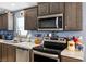 Updated kitchen featuring stainless steel appliances, sleek countertops, and modern fixtures enhancing its appeal at 320 W Van Buren Ave, Las Vegas, NV 89106