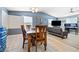 Open-concept living room features a dining area and sleek, modern furniture creating an inviting, spacious atmosphere at 320 W Van Buren Ave, Las Vegas, NV 89106
