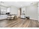 Open living space with hardwood floors, featuring sleek cabinets, countertops and seating area at 320 W Van Buren Ave, Las Vegas, NV 89106