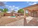 Backyard featuring pool, patio, rock waterfall, and shed offering outdoor living at 3221 Birdwatcher Ave, North Las Vegas, NV 89084