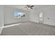 Bright bedroom with a ceiling fan and a view from the large window at 3221 Birdwatcher Ave, North Las Vegas, NV 89084