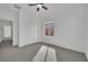 Clean bedroom with a ceiling fan, carpet, a window, and a closet with folding doors at 3221 Birdwatcher Ave, North Las Vegas, NV 89084