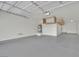 Spacious garage with ample storage, utility features, and access door at 3221 Birdwatcher Ave, North Las Vegas, NV 89084