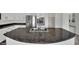 Kitchen island featuring gray speckled granite counter, stainless faucet, and sink at 3221 Birdwatcher Ave, North Las Vegas, NV 89084