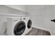 Laundry room featuring new appliances, wire shelving, and modern flooring at 3221 Birdwatcher Ave, North Las Vegas, NV 89084