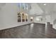 Bright and airy living room with high ceilings, tall windows, and modern lighting offers a comfortable gathering space at 3221 Birdwatcher Ave, North Las Vegas, NV 89084
