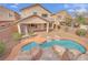 Backyard pool with rock features, offering a relaxing outdoor space at 3221 Birdwatcher Ave, North Las Vegas, NV 89084