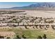 Nevada community with desert landscaping, tile roofs, and views of mountains in the distance at 3405 Kingbird Dr, North Las Vegas, NV 89084