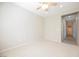 Bedroom with plush carpeting and neutral walls, with ensuite bathroom entrance at 3405 Kingbird Dr, North Las Vegas, NV 89084
