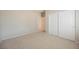 Bedroom with plush carpeting, neutral walls, and closet at 3405 Kingbird Dr, North Las Vegas, NV 89084