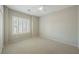 Bedroom with plush carpeting, bright natural light from the shuttered window, and neutral walls at 3405 Kingbird Dr, North Las Vegas, NV 89084