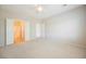 Bright, carpeted bedroom showcasing double doors leading to ensuite bathroom at 3405 Kingbird Dr, North Las Vegas, NV 89084