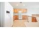 The kitchen boasts stainless steel appliances, wood cabinets, and ample counter space for meal preparation at 3405 Kingbird Dr, North Las Vegas, NV 89084