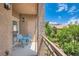 Private balcony with seating offers tranquil outdoor space and beautiful views at 3820 Wiggins Bay St # 201, Las Vegas, NV 89129