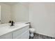 Bathroom with white vanity, modern black faucet, and large mirror at 3820 Wiggins Bay St # 201, Las Vegas, NV 89129