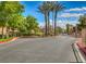 Gated community entrance with palm trees and well-maintained landscaping at 3820 Wiggins Bay St # 201, Las Vegas, NV 89129