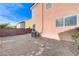 Backyard features a stucco wall and space for outdoor activities at 439 Royal Bridge Dr, Las Vegas, NV 89178