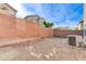 Backyard features a stucco wall and space for outdoor activities at 439 Royal Bridge Dr, Las Vegas, NV 89178