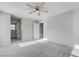 Bedroom with neutral walls, plush carpeting, and a ceiling fan for added comfort at 439 Royal Bridge Dr, Las Vegas, NV 89178