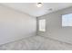 This bedroom has plush carpet, neutral walls and two windows for ample natural light at 439 Royal Bridge Dr, Las Vegas, NV 89178